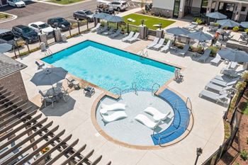 Sparkling salt-water swimming pool and fountain sprays